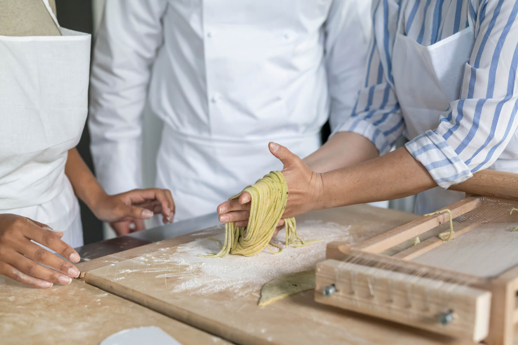 Chef teaching fresh pasta making at a gourmet cooking workshop in DC