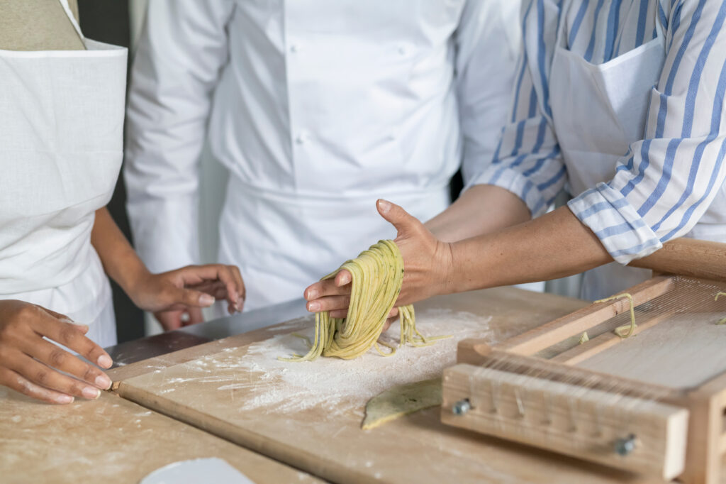 chef demonstrating how to make fresh pasta